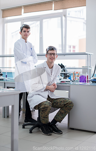 Image of Group of young medical students doing research