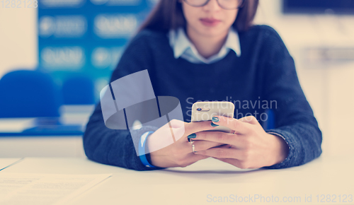 Image of female student using a mobile phone