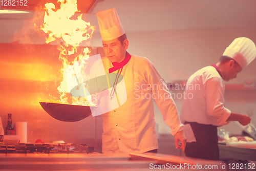 Image of Chef doing flambe on food