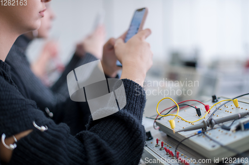 Image of female student using a mobile phone