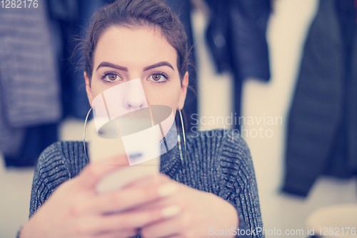 Image of female student using a mobile phone