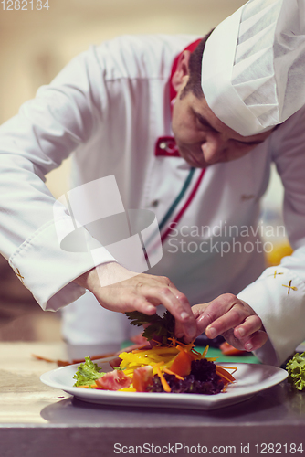 Image of chef serving vegetable salad