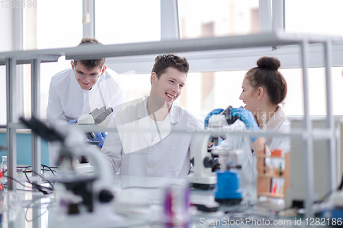 Image of Group of young medical students doing research