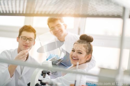 Image of Group of young medical students doing research