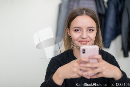 Image of female student using a mobile phone