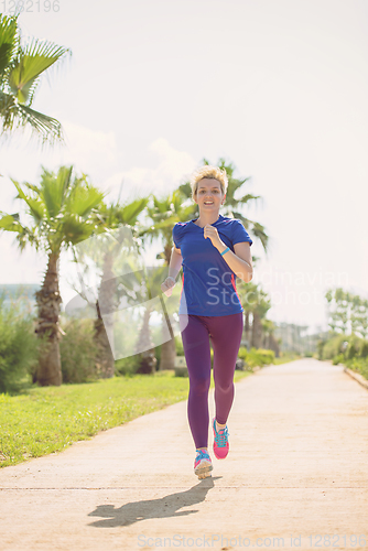 Image of young female runner training for marathon