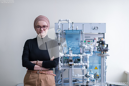 Image of portrait of muslim female student in the electronic classroom