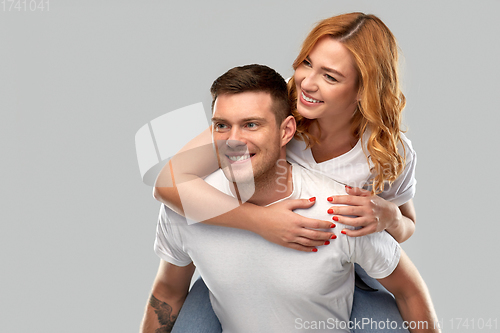 Image of happy couple in white t-shirts having fun