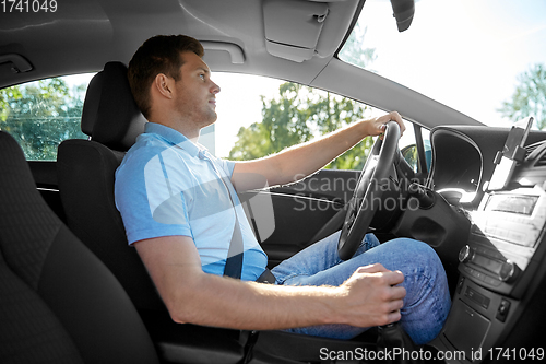Image of man or driver driving car
