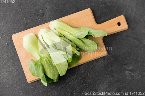 Image of bok choy chinese cabbage on wooden cutting board