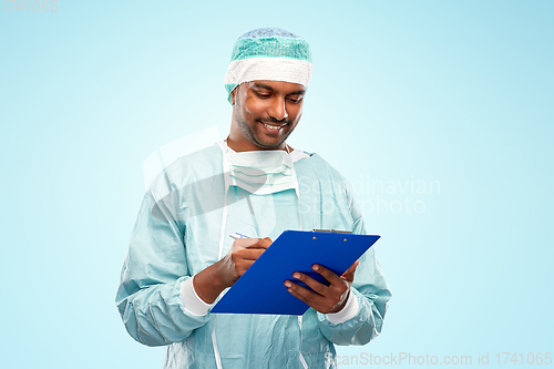 Image of indian male doctor or surgeon with clipboard