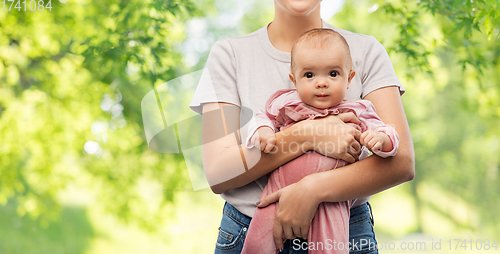 Image of happy young mother holding little baby daughter