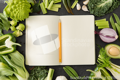 Image of green vegetables and diary with empty pages