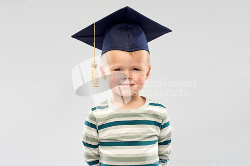 Image of smiling little boy in mortar board