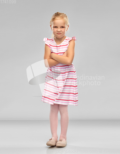 Image of displeased little girl with crossed arms pouting