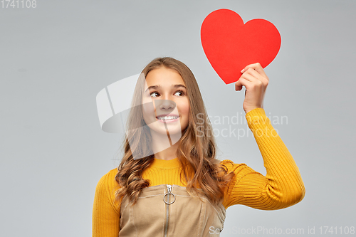 Image of smiling teenage girl with red heart