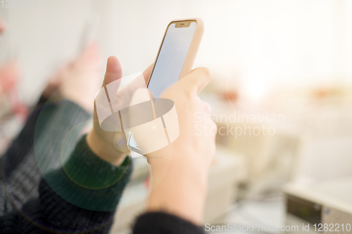 Image of female student using a mobile phone