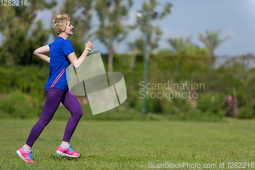 Image of young female runner training for marathon