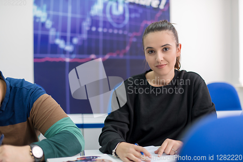 Image of female student writing notes