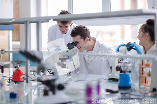 Image of Group of young medical students doing research