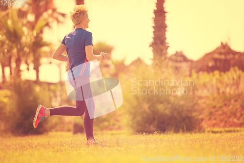 Image of young female runner training for marathon