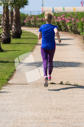 Image of young female runner training for marathon