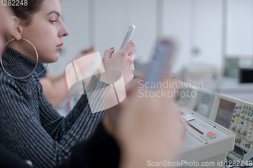 Image of female student using a mobile phone