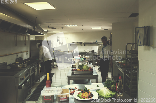 Image of team cooks and chefs preparing meals