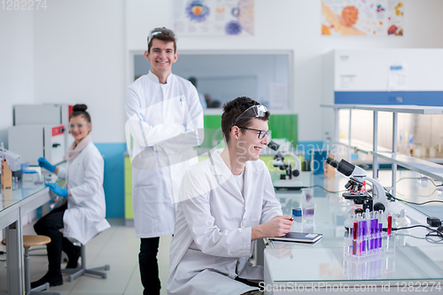 Image of Group of young medical students doing research