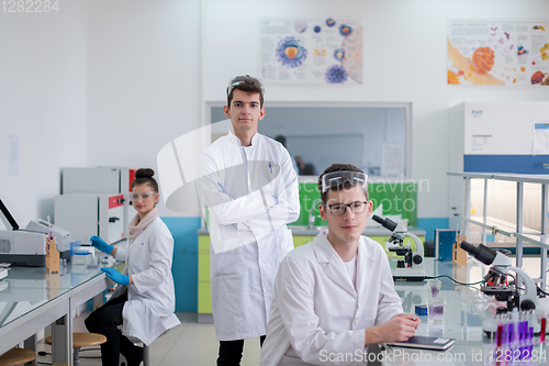 Image of Group of young medical students doing research