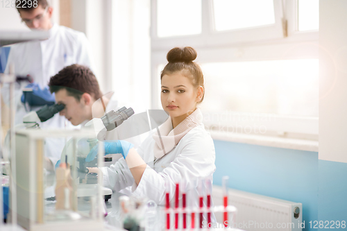 Image of Group of young medical students doing research