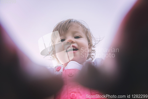 Image of little girl spending time at backyard