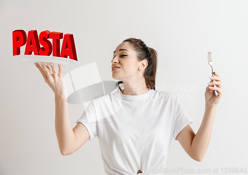 Image of Food concept. Model holding a plate with letters of Pasta