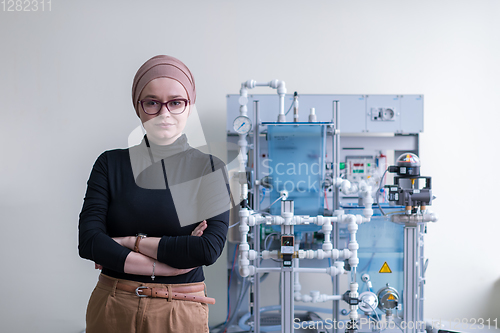 Image of portrait of muslim female student in the electronic classroom