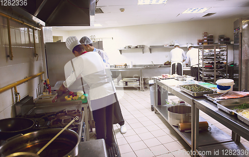 Image of team cooks and chefs preparing meals