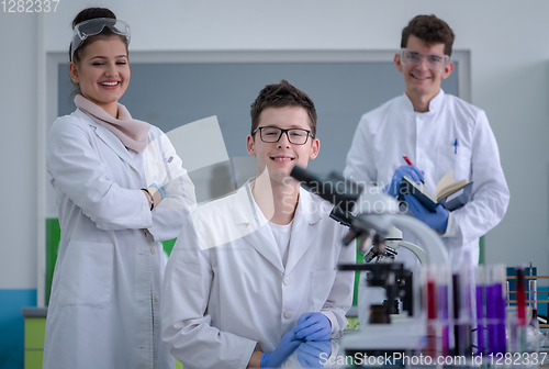 Image of Group of young medical students doing research