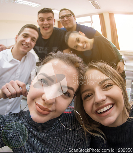 Image of young happy students doing selfie picture
