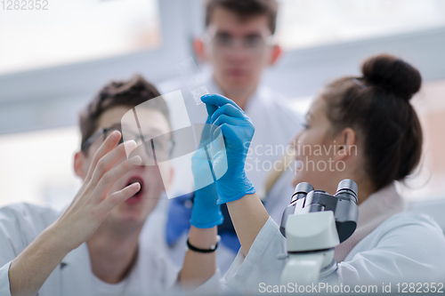 Image of Group of young medical students doing research