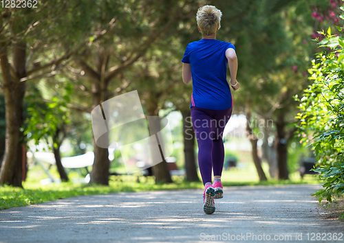 Image of young female runner training for marathon
