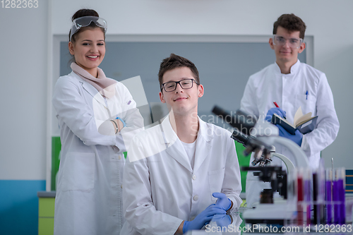 Image of Group of young medical students doing research