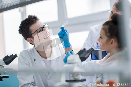 Image of Group of young medical students doing research