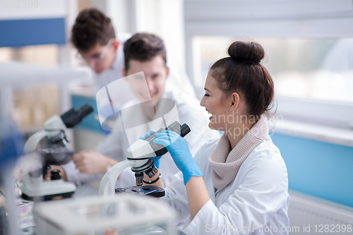 Image of Group of young medical students doing research