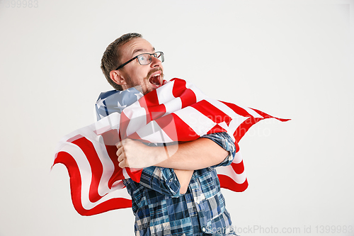 Image of Young man with the flag of United States of America