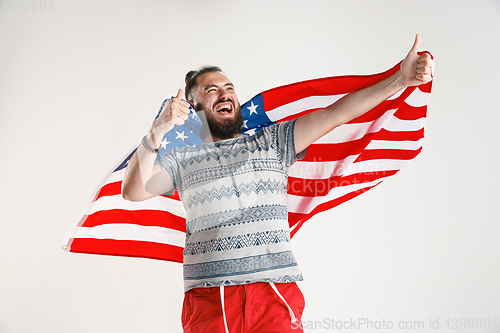 Image of Young man with the flag of United States of America