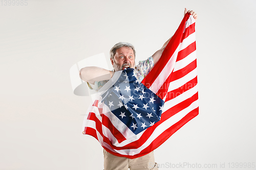 Image of Senior man with the flag of United States of America