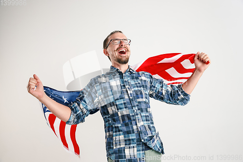 Image of Young man with the flag of United States of America