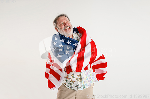 Image of Senior man with the flag of United States of America