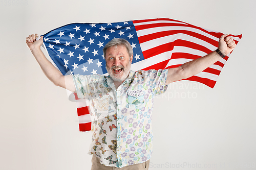 Image of Senior man with the flag of United States of America