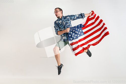 Image of Young man with the flag of United States of America