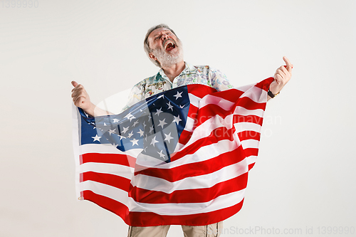 Image of Senior man with the flag of United States of America